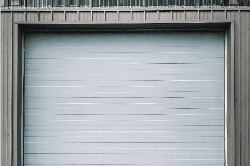 Closed white commercial roll-up garage door