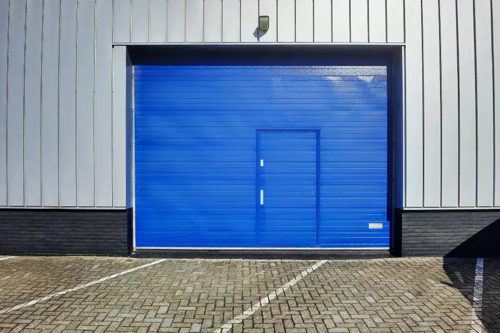 Large commercial garage door on a modern industrial warehouse