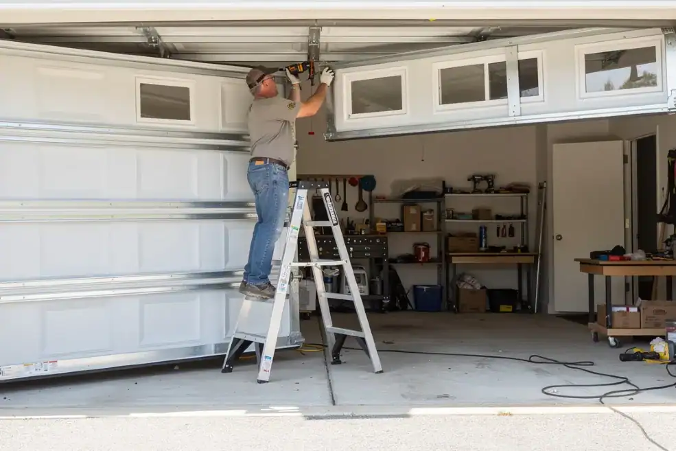 a homeowner engaged in a DIY garage door installation