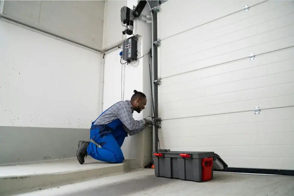 man installing new garage door