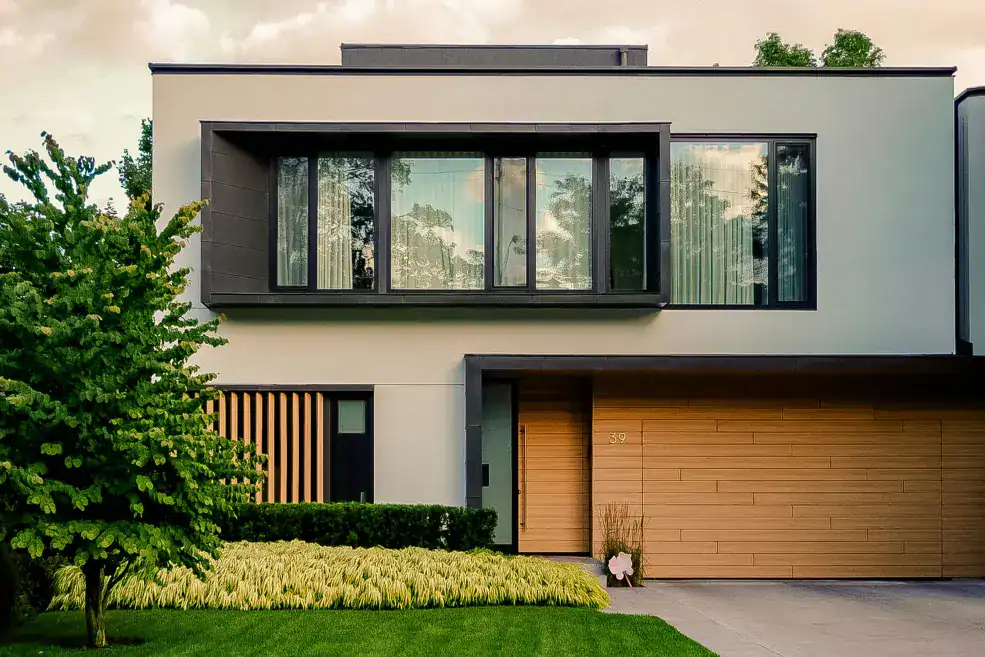 modern house with tan garage door