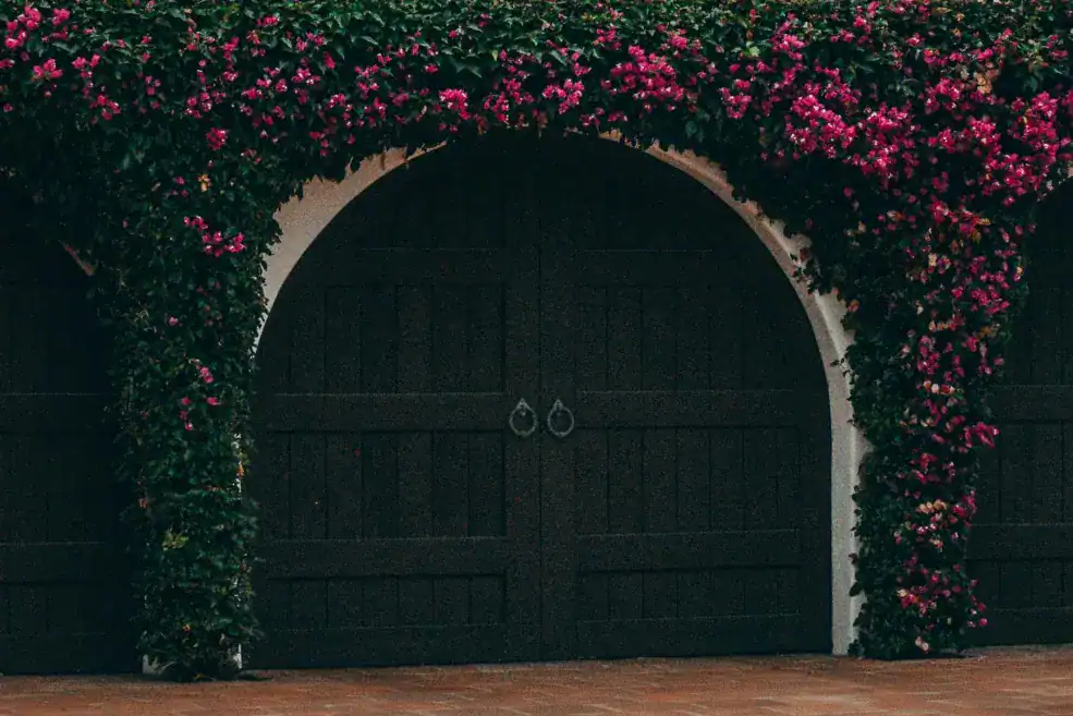 tuscan house with green carriage-style doors